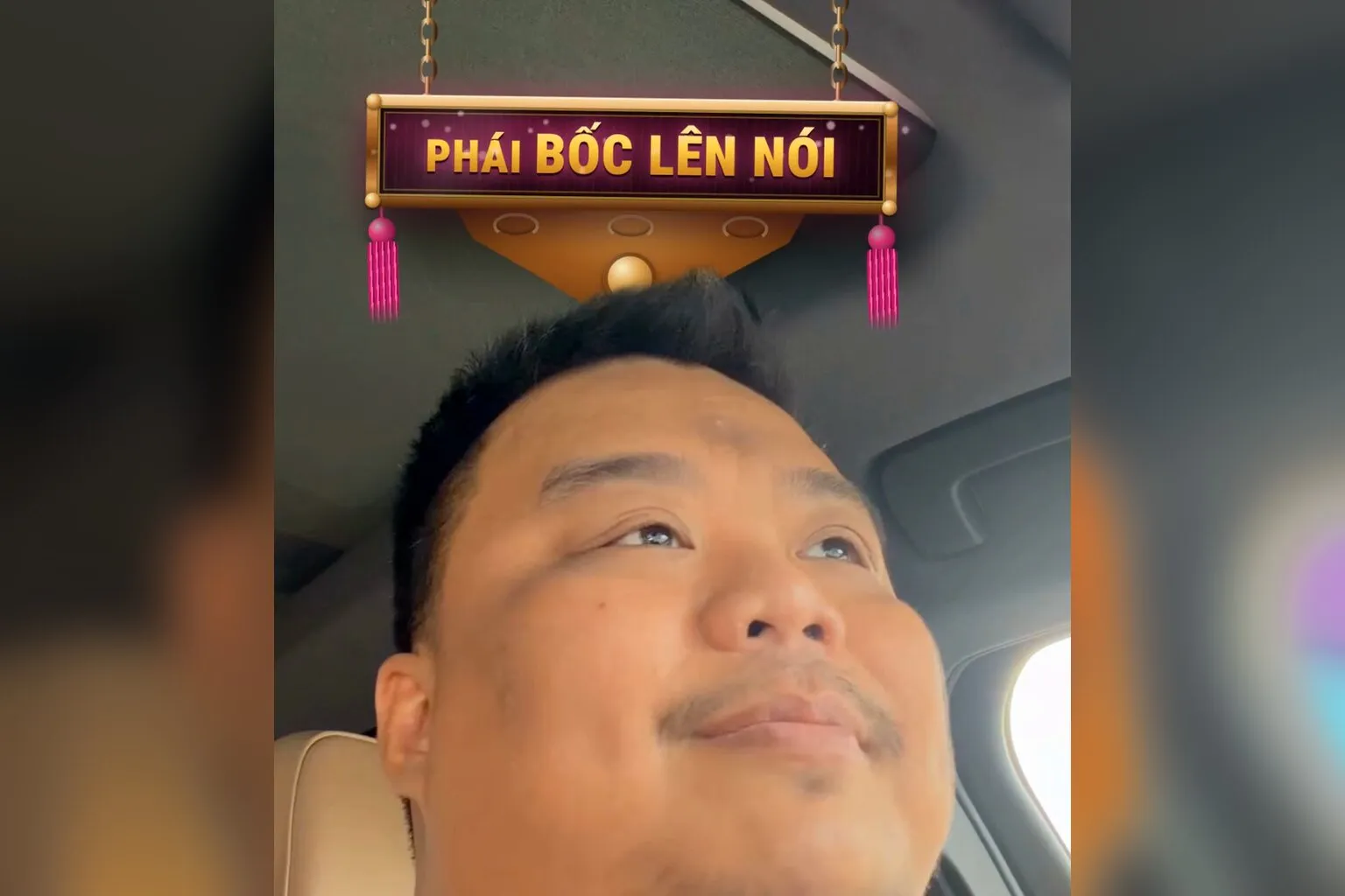 Khung hình thật: hoành phi PHÁI BỐC LÊN NÓI treo trên trần xe, trường phái quay video không cần kịch bản